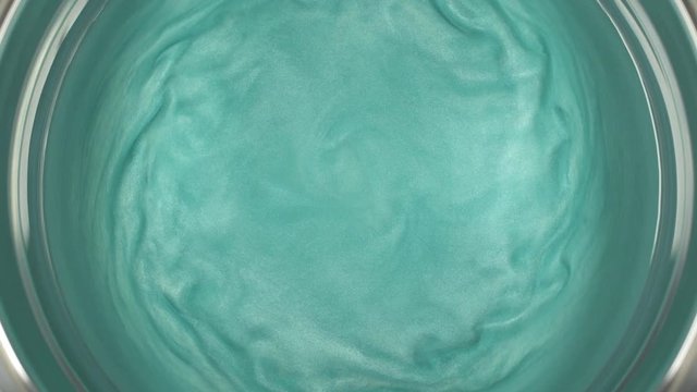 Rheoscopic fluid. Beautiful movement of particles in a liquid. Fantastic patterns and shapes.