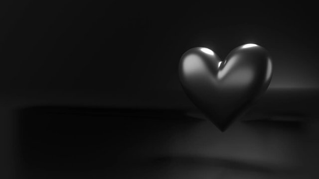 Pulsing black heart shape object on black text space.
Loop able 3D animation.