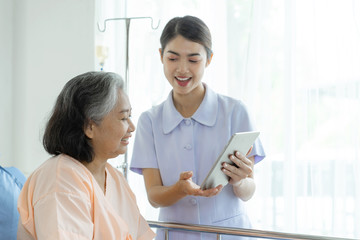nurse Inform health examination results to encourage senior elderly woman patients in the hospital-...