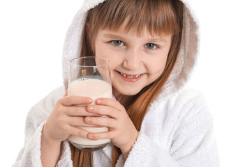 Obraz na płótnie Canvas Little girl with glass of milk on white background