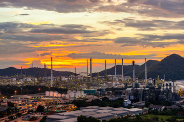 Beautiful sunset  petrochemical oil refinery factory plant cityscape of Chonburi province at night , landscape Thailand