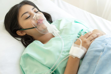 Fototapeta premium Asian woman Infected patients Coronavirus covid-19 wearing Face Mask Oxygen Respirator in quarantine room hospital, Quarantine to protect spread Covid-19