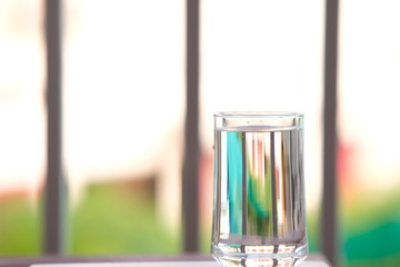 Close up glass of water on counter background and space for text 