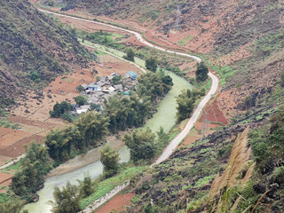 Long green river from in canyon. View from the top in mountains.