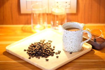 Coffee cup on wooden background and space for text 