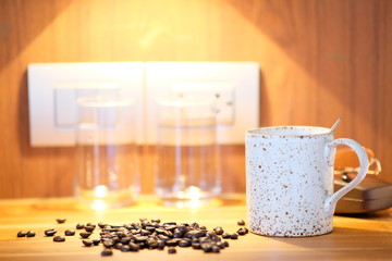 Coffee cup on wooden background and space for text 