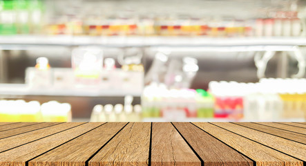 blur local supermarket convenience fresh food zone store background with wood perspective tabletop to showing product or ads banner and promote marketing on display concept	