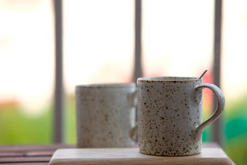 Coffee cup on wooden background and space for text 