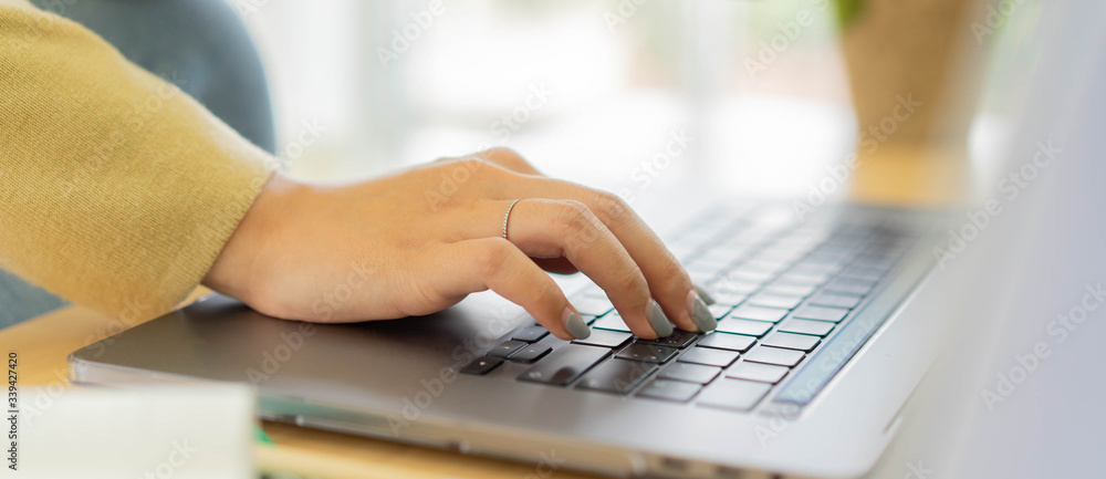 Canvas Prints close up employee woman hand typing on keyboard laptop to search optimizations on website for work f