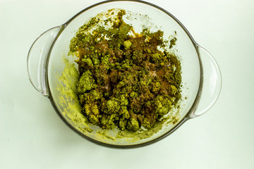 Pile of dry henna powder isolated on white.