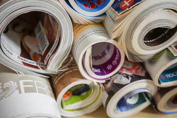 a stack of rolled magazines