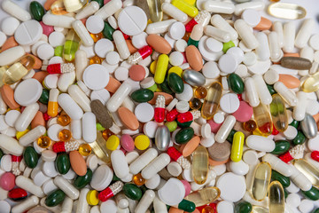 Many colored pills and capsules. Pharmacology and medicine. Background. Space for text.