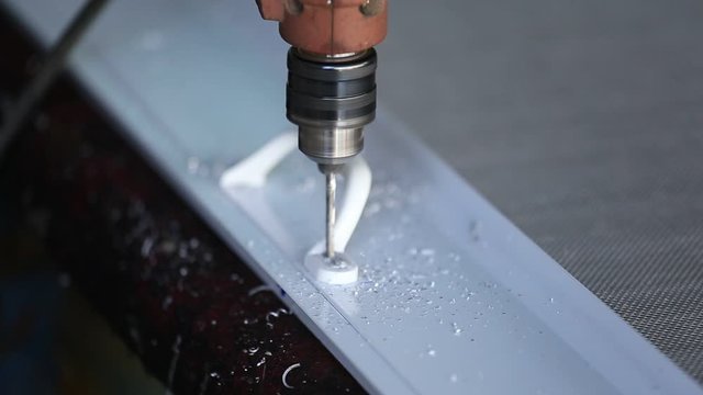 Mechanic is drilling aluminum by using a small drill to drill aluminum.