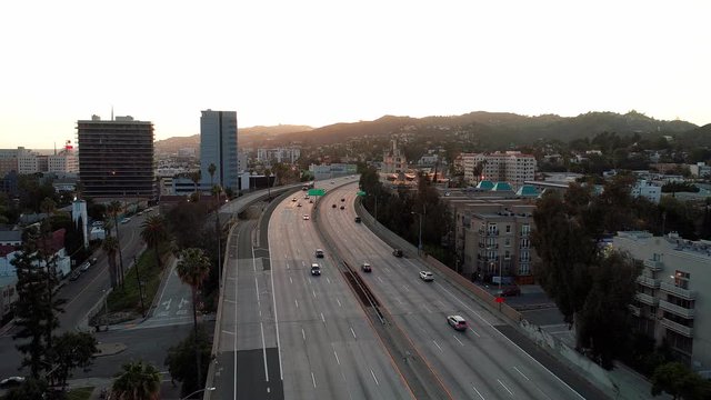 Aerial drone view across the 101-freeway - Empty during rush hour traffic in Hollywood, California during Covid-19 Coronavirus lockdown.