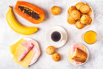 Traditional Brazilian breakfast - cheese bread, coffee, ripe fruit.