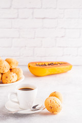 Traditional Brazilian breakfast - cheese bread, coffee, ripe fruit.