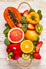 Fruits and vegetables rich in vitamin C in box. Healthy eating.