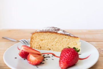 Delicious slice of cake decorated with strawberries. pastry concept.