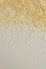 Close up view of dry sesame seeds on white background. Natural oil-rich food