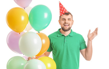Handsome man celebrating Birthday on white background