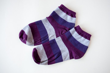 Socks with colored stripes on a light background