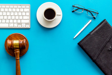 Law student office desk - gavel, computer, notebook - blue, top view copy space