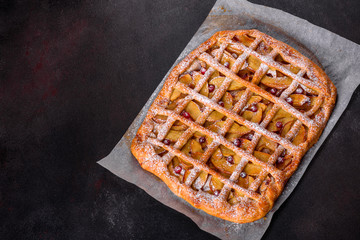 Delicious fresh pie baked with apple, pears and berries