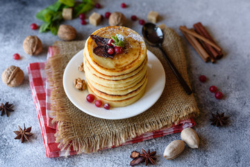 Delicious fresh beautiful pancakes with citrus honey and jam