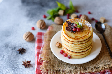 Delicious fresh beautiful pancakes with citrus honey and jam
