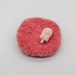 Cute Mini ice-cream bath bomb on red fluffy carpet