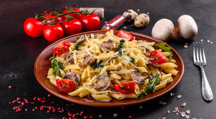 Pasta with mushrooms, cheese, spinach, rukkola and cherry tomatoes