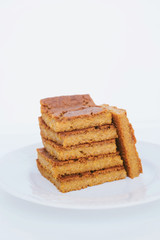 Stack of blondie brownie dessert slices, close up.
