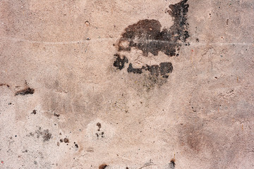 Texture of a concrete wall with cracks and scratches which can be used as a background