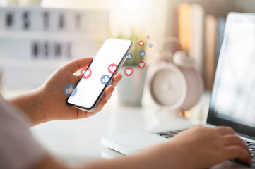 Hand using smart phone with Social media concept