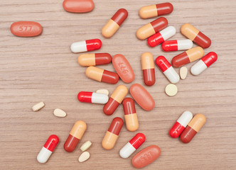 pile of messy pills by the table