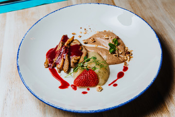 Duck fillet with chocolate sauce, berries and juniper sauce.