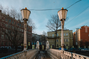 Fototapeta na wymiar Sights of Saint Petersburg, morning spring, bridge with statues of white lions