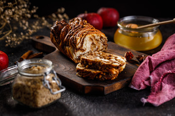 Swirl brioche or traditional Polish babka cake with walnut, apple and honey