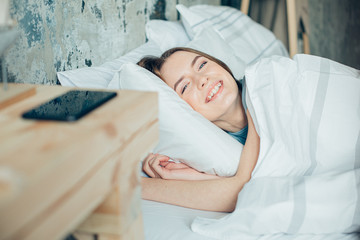 Happy lady waking up and smiling stock photo