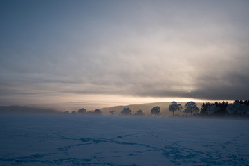 relaxing overcast moudy clouds in a winter valley while sunrise and sundown in a uphill winter...
