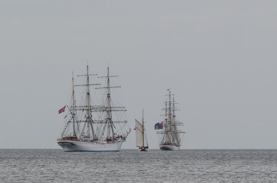 SWINOUJSCIE, WEST POMERANIAN / POLAND - 2017: The Norwegian sailing ship STATSRAAD LEHMKUHL, Polish ship GENERAL ZARUSKI and RNOV SHABAB OMAN flows on the maritime waterway