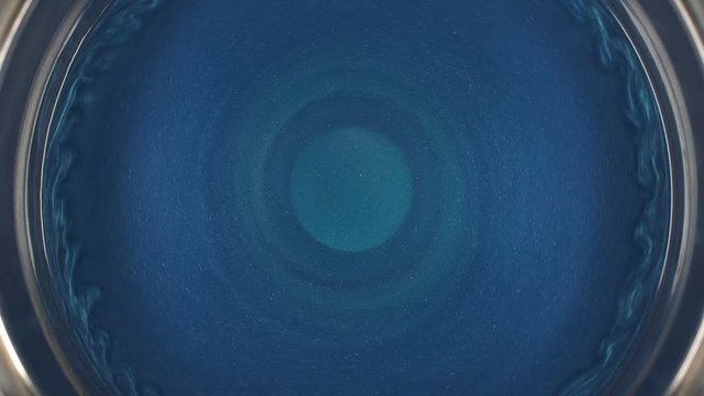 Rheoscopic fluid. Beautiful movement of particles in a liquid. Fantastic patterns and shapes. 50 fps