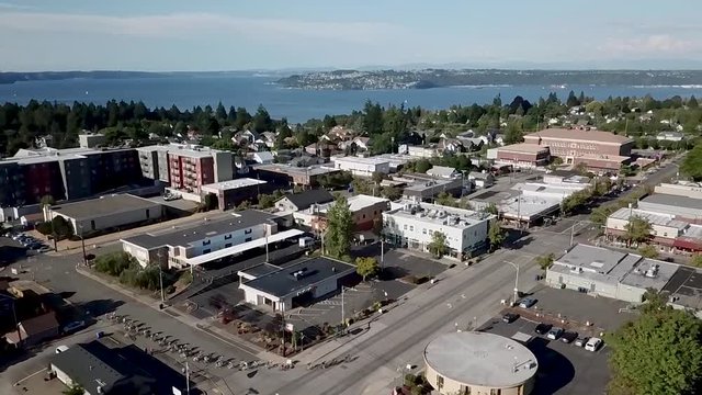 Aerial View Of Criterium Race in Tacoma, Washington With Different Buildings On A Bright Sunny Day - Aerial Shot
