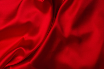 Red silk or satin luxury fabric texture can use as abstract background.