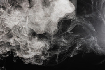 White steam on a black background.