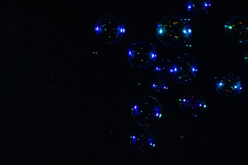 Soap bubbles isolated on a black background. Copy space.