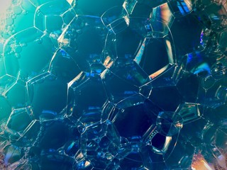 Soap bubbles on dark background. noise film grain so conceived, background texture