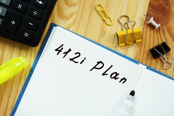 The photo shows 412i Plan. Notepad, heap, marker.