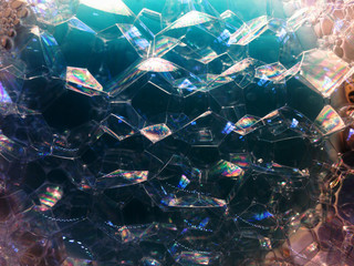 Soap bubbles on dark background. noise film grain so conceived, background texture