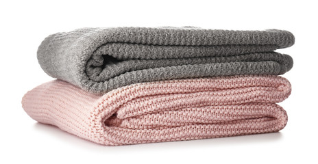 Soft blankets on white background